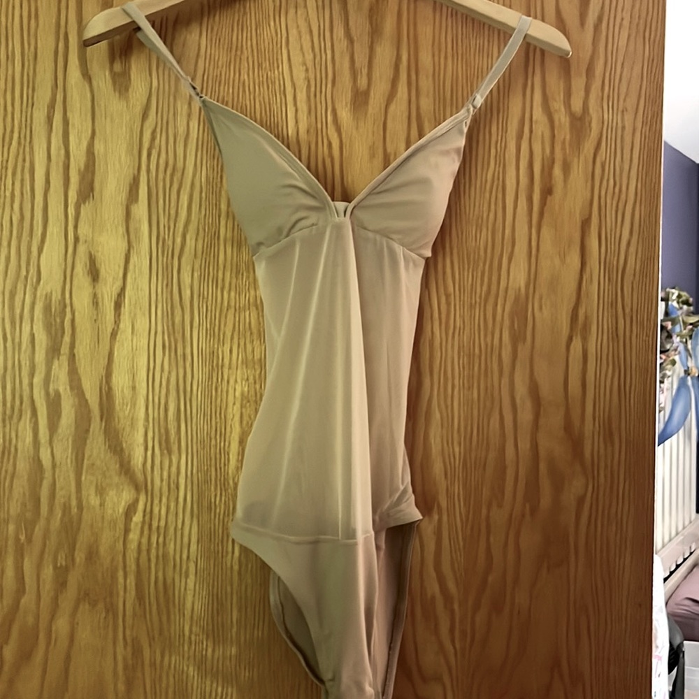 Capezio size large nude and mesh bodysuit.